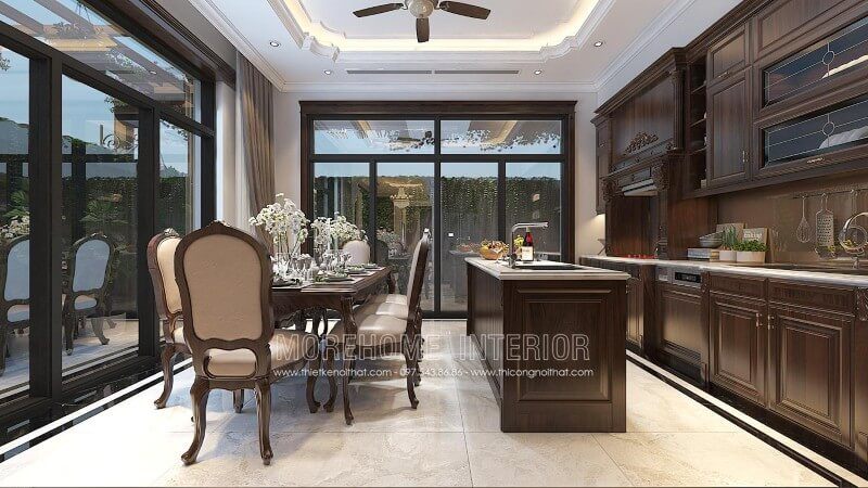 Mẫu tủ bếp tân cổ điển được bố trí ở trung tâm phòng bếp, tạo nên một khu vực nấu nướng riêng biệt, giúp cho công việc nấu nướng của chị em nội trợ trở nên dễ dàng hơn.